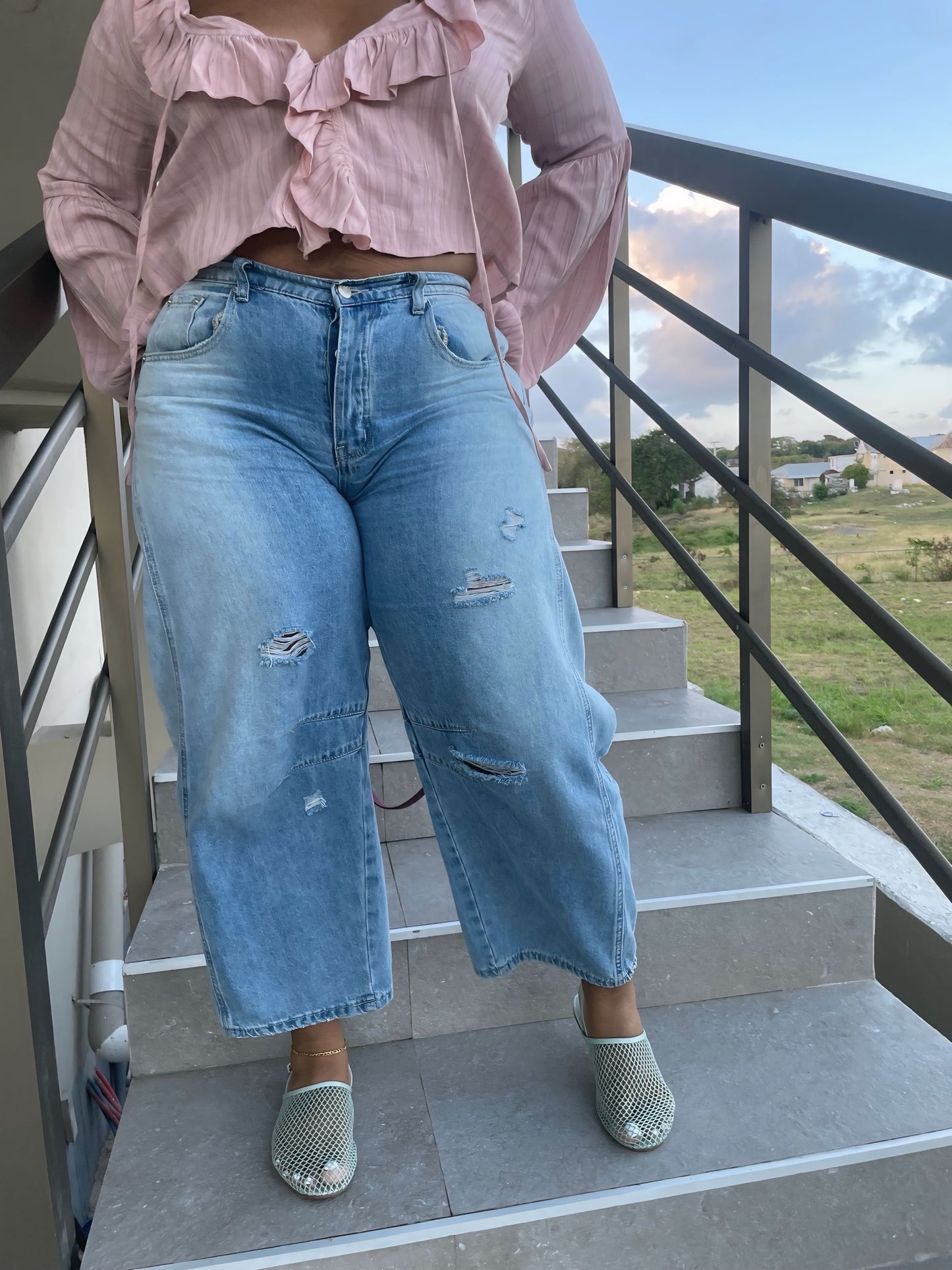 Distressed mid rise barrel ankle jeans