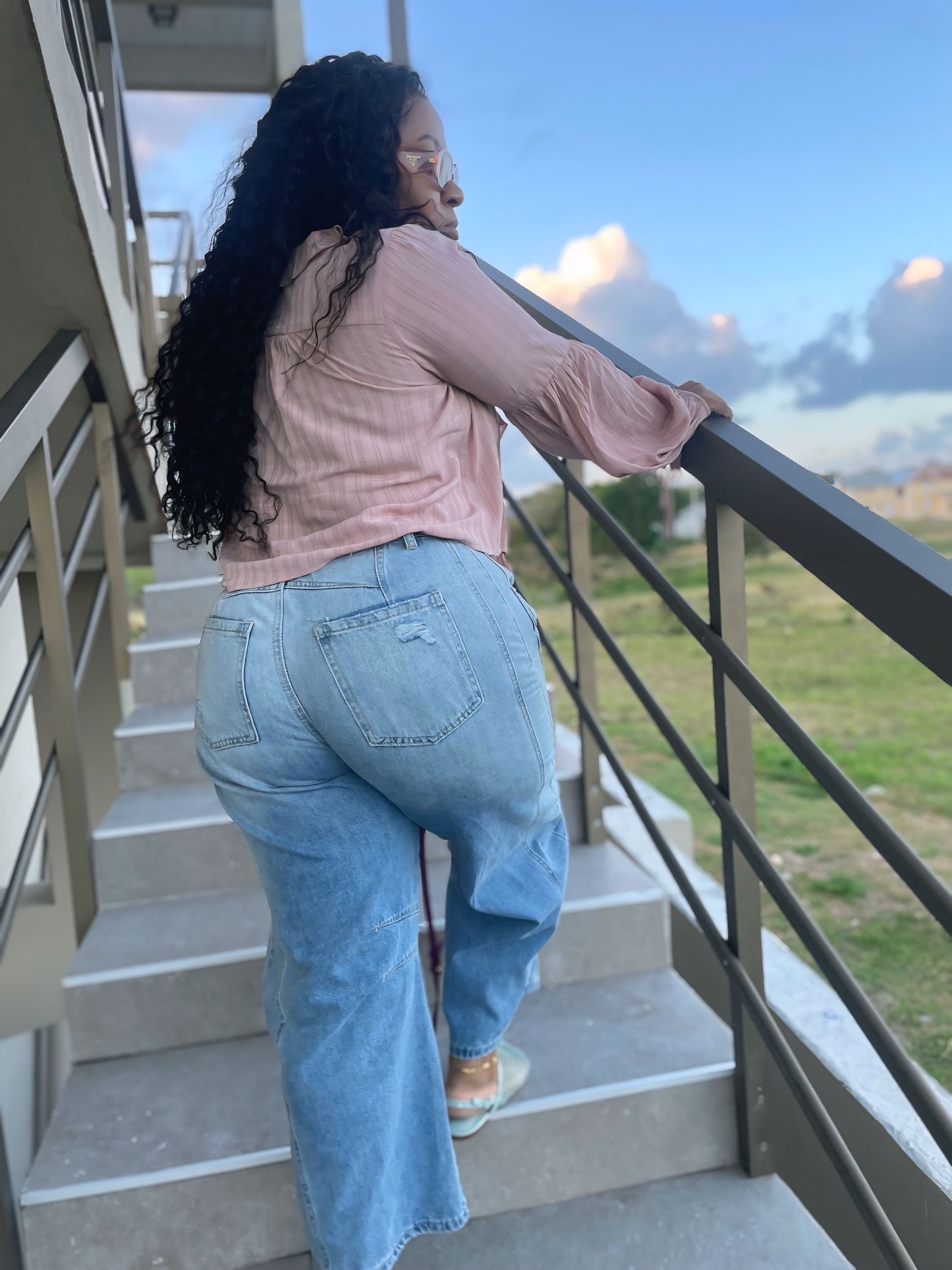 Distressed mid rise barrel ankle jeans